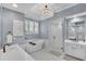 Bright bathroom featuring a freestanding tub, a double vanity, and frameless shower at 1555 Heritage Trl, Roswell, GA 30075