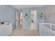 Calming bedroom space featuring light blue walls and a neutral color palette with mountain wall art at 1555 Heritage Trl, Roswell, GA 30075