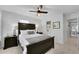 Relaxing bedroom featuring a comfortable bed and ceiling fan, creating a tranquil retreat within the home at 1555 Heritage Trl, Roswell, GA 30075