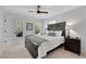 Cozy bedroom with neutral tones, natural lighting, and minimalist decor creating a serene and inviting atmosphere at 1555 Heritage Trl, Roswell, GA 30075