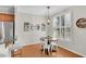 Charming dining area with natural light, wood floors, and access to the kitchen at 1555 Heritage Trl, Roswell, GA 30075