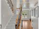 Elegant foyer with a staircase and hardwood floors, offering a bright and spacious entrance at 1555 Heritage Trl, Roswell, GA 30075
