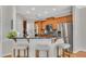 Kitchen bar featuring granite countertop, barstool seating, and stainless steel appliances at 1555 Heritage Trl, Roswell, GA 30075