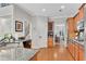 Updated kitchen with granite counters, stainless steel sink, and access to dining area at 1555 Heritage Trl, Roswell, GA 30075