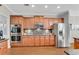 Well-equipped kitchen featuring stainless steel appliances, granite countertops, and ample cabinet space at 1555 Heritage Trl, Roswell, GA 30075