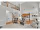 Open concept living room with staircase leading up to the loft at 1555 Heritage Trl, Roswell, GA 30075