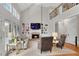 Spacious living room with vaulted ceiling, fireplace, and a view of the loft at 1555 Heritage Trl, Roswell, GA 30075