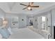 Spacious main bedroom with ceiling fan, and access to the main bathroom at 1555 Heritage Trl, Roswell, GA 30075