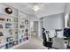 Well-lit office featuring built-in bookshelves and a workspace conducive for efficient remote work at 1555 Heritage Trl, Roswell, GA 30075