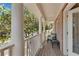 Charming porch with cozy seating, offering a relaxing outdoor space to enjoy the neighborhood views at 1555 Heritage Trl, Roswell, GA 30075