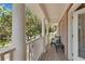 Charming porch with cozy seating, offering a relaxing outdoor space to enjoy the neighborhood views at 1555 Heritage Trl, Roswell, GA 30075