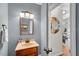 Stylish powder room featuring modern vanity and neutral paint color at 1555 Heritage Trl, Roswell, GA 30075