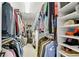 Spacious walk-in closet with custom shelving and ample hanging space for organized clothing and accessories at 1555 Heritage Trl, Roswell, GA 30075