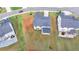 Aerial view features houses with ample green lawns and landscaping in a well-planned neighborhood setting at 3180 Andover St, Cumming, GA 30028