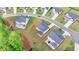 Aerial view of lush green properties in a suburban neighborhood with landscaping and new home construction at 3180 Andover St, Cumming, GA 30028