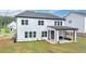 A beautiful two-story home with a well-maintained lawn and covered patio at 3180 Andover St, Cumming, GA 30028