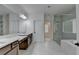 Modern bathroom with double sinks, a spacious shower, and tile flooring at 3180 Andover St, Cumming, GA 30028