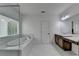Bright bathroom features a soaking tub and double sink vanity with plenty of counter space at 3180 Andover St, Cumming, GA 30028