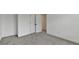 Bedroom featuring neutral walls, gray carpet and a double door closet at 3180 Andover St, Cumming, GA 30028