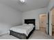 Relaxing bedroom featuring carpeted floors and an ensuite bathroom with a closet at 3180 Andover St, Cumming, GA 30028