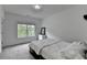 Cozy bedroom with plush carpet, a bright window, and a neutral color palette at 3180 Andover St, Cumming, GA 30028
