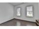 Bright bedroom features beautiful hardwood floors and two windows allowing natural light at 3180 Andover St, Cumming, GA 30028