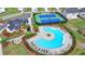 An aerial shot showcases a community pool, tennis courts, and manicured grounds in a lovely neighborhood at 3180 Andover St, Cumming, GA 30028