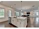 Kitchen with bright lighting that looks into the living room and dining room at 3180 Andover St, Cumming, GA 30028