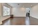Bright living room features hardwood floors, neutral walls, and lots of sunlight at 3180 Andover St, Cumming, GA 30028