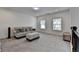 Comfortable upstairs loft provides ample seating and natural light from two rear-facing windows at 3180 Andover St, Cumming, GA 30028