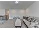 Spacious upstairs loft featuring a comfortable sofa with decorative pillows and plenty of open space at 3180 Andover St, Cumming, GA 30028