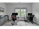 Spacious office features carpeted floors, two desks, and a bright window at 3180 Andover St, Cumming, GA 30028
