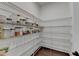 Spacious walk-in pantry with adjustable wire shelving for optimal storage and organization at 3180 Andover St, Cumming, GA 30028
