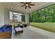 Covered patio with comfortable seating overlooking a large yard and wooded area at 3180 Andover St, Cumming, GA 30028