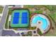 An aerial view of a community pool and tennis courts nestled in a well-landscaped neighborhood at 3180 Andover St, Cumming, GA 30028