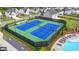 A nice community featuring well-kept tennis courts adjacent to neighborhood houses and a pool at 3180 Andover St, Cumming, GA 30028