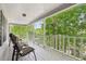 Spacious back porch with seating, perfect for enjoying the serene, wooded view at 3876 Winners Ct, Marietta, GA 30062