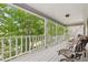 Inviting back porch offering a peaceful retreat with lovely views of the surrounding greenery at 3876 Winners Ct, Marietta, GA 30062