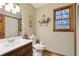 Bathroom featuring classic style with stained glass and patterned wallpaper at 3876 Winners Ct, Marietta, GA 30062