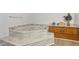Unique bathroom with corner tub, wood cabinets, and marble countertops at 3876 Winners Ct, Marietta, GA 30062
