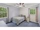 Bright bedroom with ceiling fan, natural light, and a comfortable bed at 3876 Winners Ct, Marietta, GA 30062