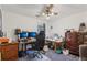 This bedroom offers a ceiling fan and two work stations and is equipped with multiple monitors at 3876 Winners Ct, Marietta, GA 30062
