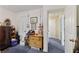 Bedroom with blue carpet, drawers, and access to other rooms in the home at 3876 Winners Ct, Marietta, GA 30062