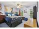 Blue bedroom featuring a bed, a desk with computers, a ceiling fan, and a backyard view at 3876 Winners Ct, Marietta, GA 30062