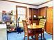 Cozy dining area with a wood table and chairs, alongside built-in shelves and pantry at 3876 Winners Ct, Marietta, GA 30062