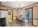 Charming eat-in kitchen featuring a wooden table and chairs, and a sliding glass door at 3876 Winners Ct, Marietta, GA 30062