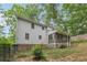 Beautiful home with a screened porch, complemented by lush greenery and natural surroundings at 3876 Winners Ct, Marietta, GA 30062