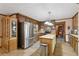 Cozy kitchen featuring stainless steel appliances, an island, and wooden cabinetry at 3876 Winners Ct, Marietta, GA 30062