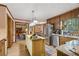 Open kitchen design showcasing an island, stainless steel appliances, and seamless flow to living spaces at 3876 Winners Ct, Marietta, GA 30062