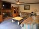 Cozy living room with brick fireplace, sofas, and hardwood entertainment center at 3876 Winners Ct, Marietta, GA 30062
